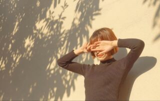 Woman Standing in the Sunlight