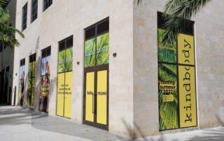 A storefront with vivid custom window film applied.