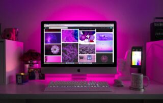 Computer Screen in a Purple-Lit Room