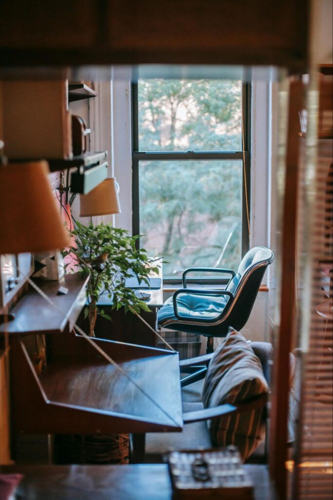 Chair and Desk Near a Shady Window