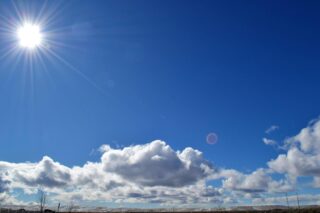 Sun Shining Above Clouds in the Open